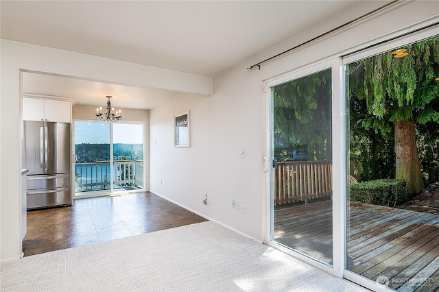 3719 NE 145th St, Seattle, WA 98155 - spare room featuring a chandelier and baseboards