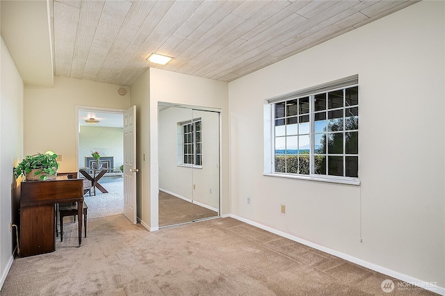 3719 NE 145th St, Seattle, WA 98155 - carpeted empty room with baseboards and wood ceiling