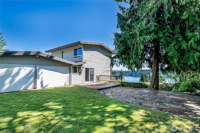3719 NE 145th St, Seattle, WA 98155 - rear view of property with a yard, a deck with water view, and a garage