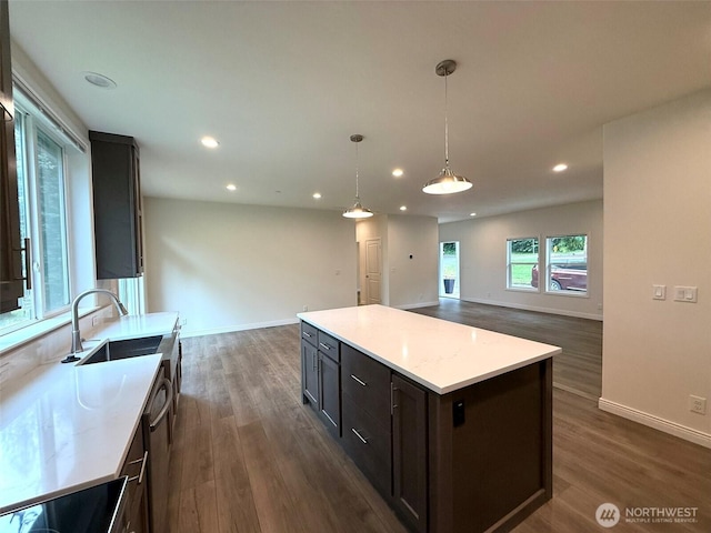 45332 Limestone St, Concrete, WA 98237 - kitchen featuring open floor plan, recessed lighting, dark wood-style floors, a kitchen island, and hanging light fixtures