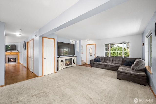 1877 Emerald Way, Lynden, WA 98264 - carpeted living room featuring a tile fireplace and baseboards