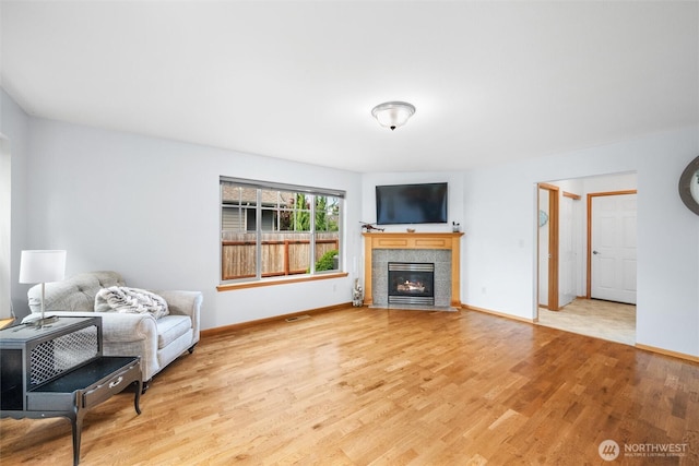 1877 Emerald Way, Lynden, WA 98264 - living room with wood finished floors and a tiled fireplace