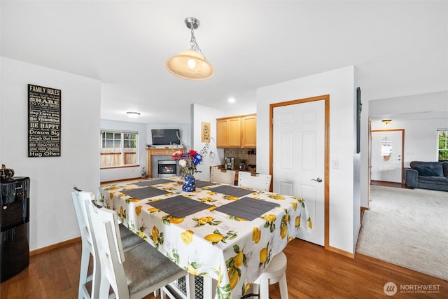 1877 Emerald Way, Lynden, WA 98264 - dining room with wood finished floors, a tiled fireplace, and recessed lighting