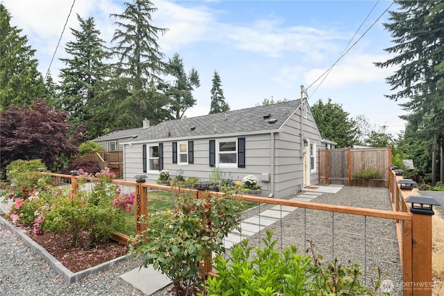 18328 15th Pl NE, Shoreline, WA 98155 - ranch-style home with a shingled roof and a garden