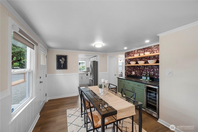 18328 15th Pl NE, Shoreline, WA 98155 - dining room with wine cooler, a bar, dark wood finished floors, plenty of natural light, and ornamental molding