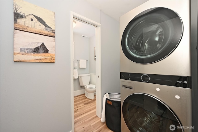 10816 NE 154th Pl, Bothell, WA 98011 - laundry area with stacked washer / drying machine and wood finished floors