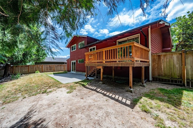 10816 NE 154th Pl, Bothell, WA 98011 - back of property featuring a fenced backyard, a patio area, a wooden deck, and stairway