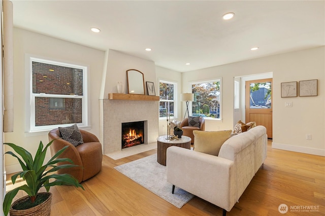 3430 42nd Ave SW, Seattle, WA 98116 - living room with a fireplace with flush hearth, light wood-style flooring, plenty of natural light, and recessed lighting