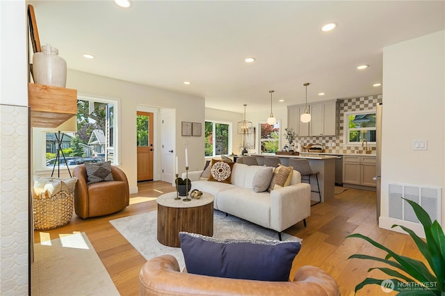 3430 42nd Ave SW, Seattle, WA 98116 - living area with recessed lighting and light wood-style floors