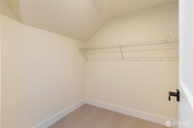 3430 42nd Ave SW, Seattle, WA 98116 - walk in closet featuring carpet and lofted ceiling