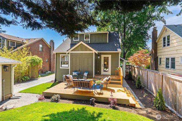 3430 42nd Ave SW, Seattle, WA 98116 - rear view of property featuring a deck, roof with shingles, and board and batten siding