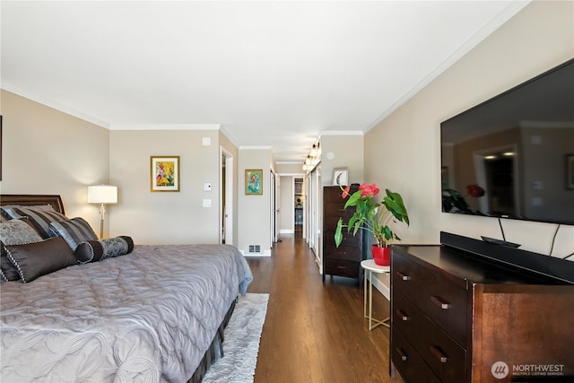 9717 NE Juanita Dr Unit 101, Kirkland, WA 98034 - bedroom featuring dark wood finished floors and crown molding