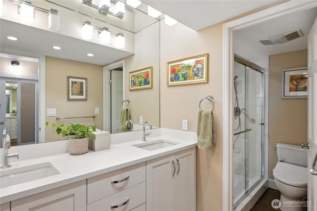 9717 NE Juanita Dr Unit 101, Kirkland, WA 98034 - bathroom with double vanity, a stall shower, and recessed lighting