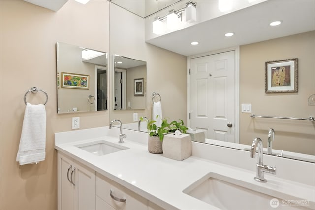 9717 NE Juanita Dr Unit 101, Kirkland, WA 98034 - bathroom with double vanity and recessed lighting