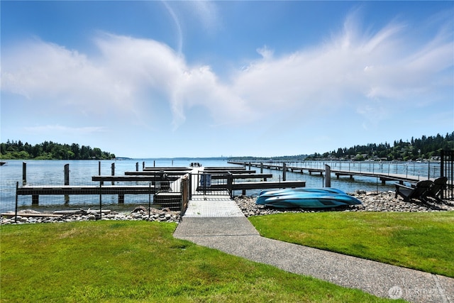 9717 NE Juanita Dr Unit 101, Kirkland, WA 98034 - dock area with a water view and a lawn