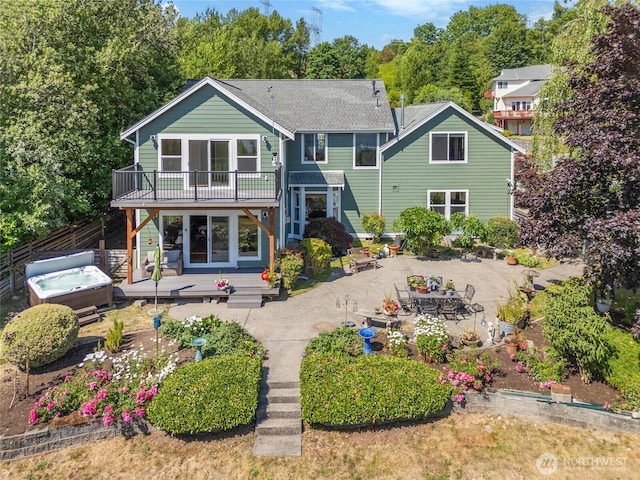 3319 Sunny Cove Ct, Bellingham, WA 98226 - back of house with a hot tub, a patio, a deck, and a shingled roof