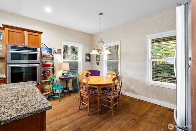 3319 Sunny Cove Ct, Bellingham, WA 98226 - dining space with wood finished floors and a chandelier