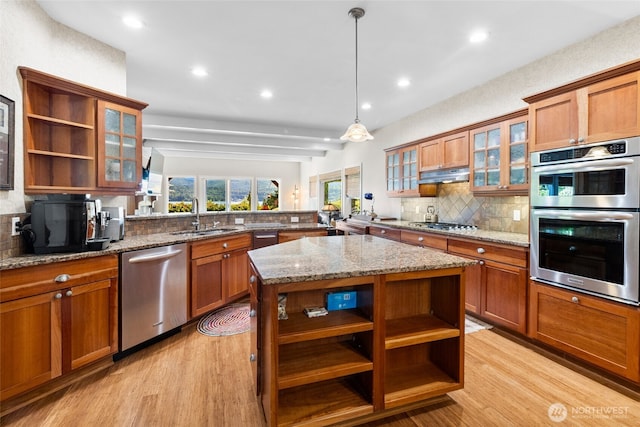 3319 Sunny Cove Ct, Bellingham, WA 98226 - kitchen with open shelves, appliances with stainless steel finishes, brown cabinetry, backsplash, and recessed lighting