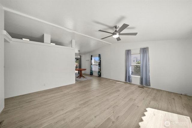 1809 Heritage Hvn, Wenatchee, WA 98801 - unfurnished living room featuring plenty of natural light, wood finished floors, lofted ceiling, and ceiling fan