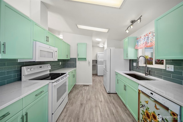 1809 Heritage Hvn, Wenatchee, WA 98801 - kitchen with white appliances, decorative backsplash, green cabinets, and light wood finished floors