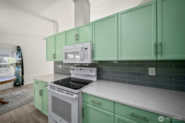 1809 Heritage Hvn, Wenatchee, WA 98801 - kitchen with white appliances, green cabinetry, and dark wood-type flooring