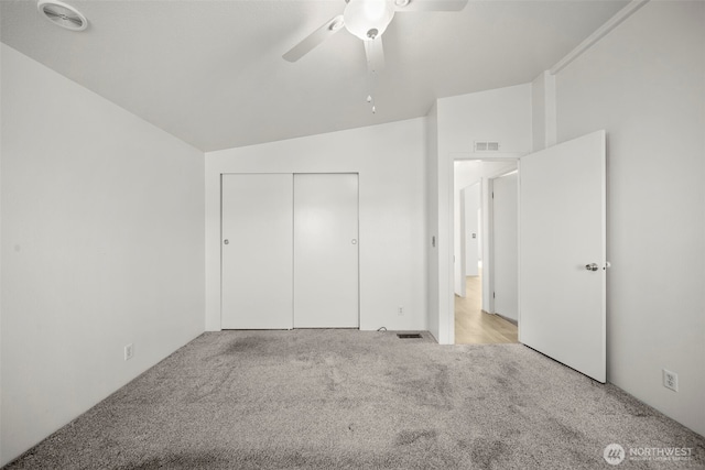 1809 Heritage Hvn, Wenatchee, WA 98801 - unfurnished bedroom featuring carpet flooring, vaulted ceiling, a closet, and a ceiling fan