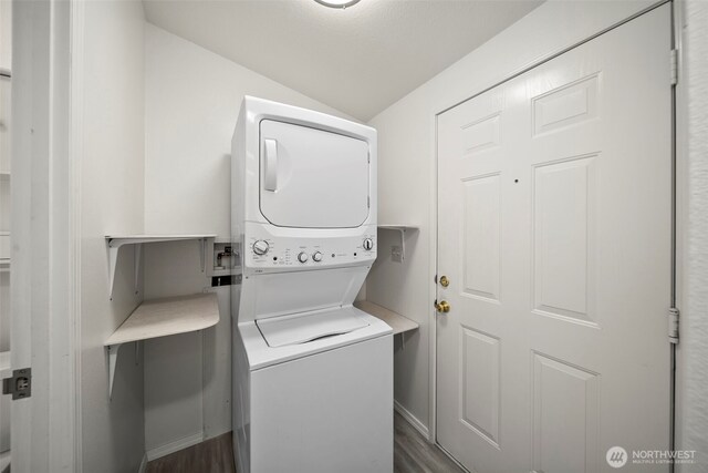 1809 Heritage Hvn, Wenatchee, WA 98801 - laundry room with stacked washer / dryer and dark wood-style flooring