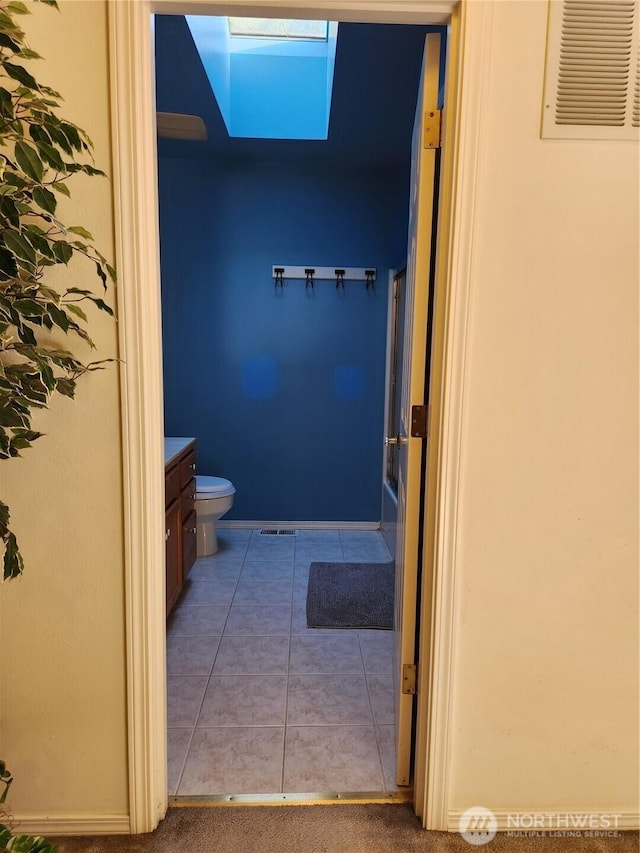 22528 100th Ave SE, Kent, WA 98031 - bathroom with vanity, tile patterned floors, and a skylight