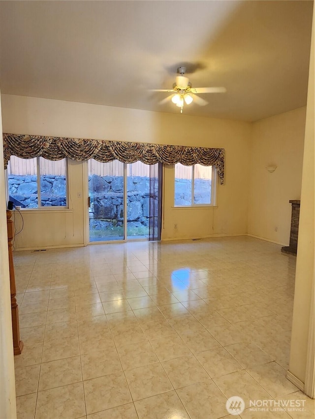 22528 100th Ave SE, Kent, WA 98031 - unfurnished room featuring ceiling fan and light tile patterned flooring