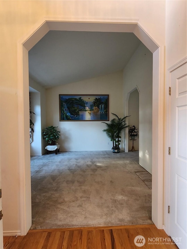 22528 100th Ave SE, Kent, WA 98031 - hall with arched walkways, vaulted ceiling, and carpet flooring