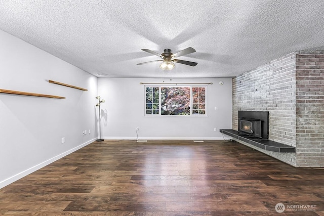 4402 Clearwater Dr SE, Lacey, WA 98503 - unfurnished living room featuring ceiling fan, wood finished floors, a textured ceiling, and a fireplace