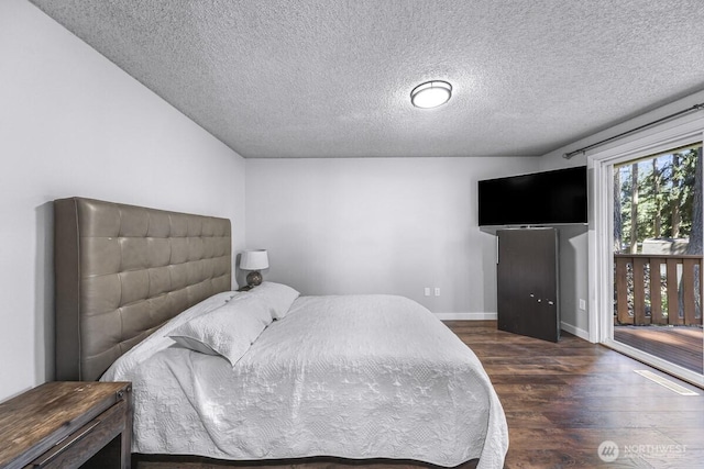 4402 Clearwater Dr SE, Lacey, WA 98503 - bedroom featuring dark wood-type flooring and a textured ceiling