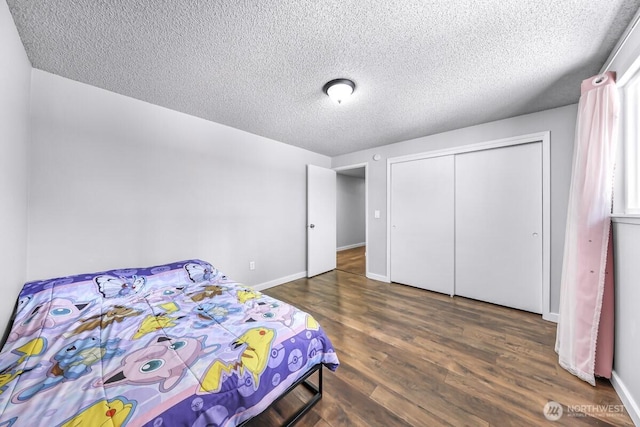 4402 Clearwater Dr SE, Lacey, WA 98503 - bedroom featuring a textured ceiling, wood finished floors, and a closet