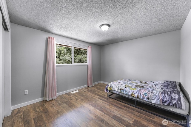 4402 Clearwater Dr SE, Lacey, WA 98503 - bedroom featuring a textured ceiling and wood finished floors