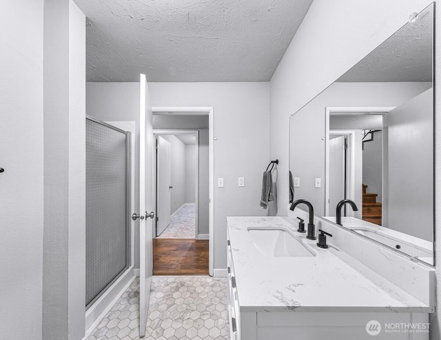 4402 Clearwater Dr SE, Lacey, WA 98503 - bathroom with vanity, a shower stall, a textured ceiling, and tile patterned flooring