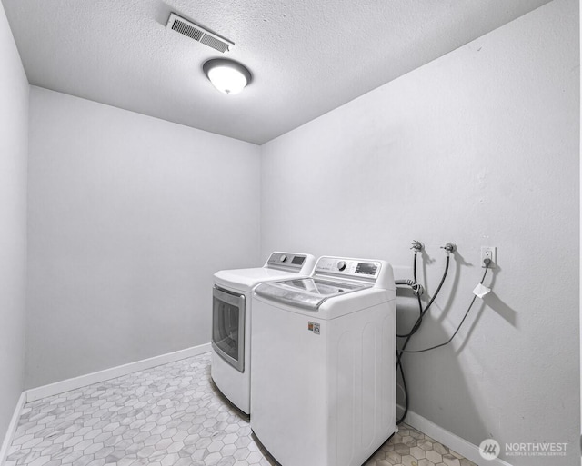 4402 Clearwater Dr SE, Lacey, WA 98503 - laundry room featuring independent washer and dryer and a textured ceiling
