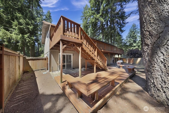 4402 Clearwater Dr SE, Lacey, WA 98503 - back of property featuring a wooden deck, a fenced backyard, stairway, and a patio