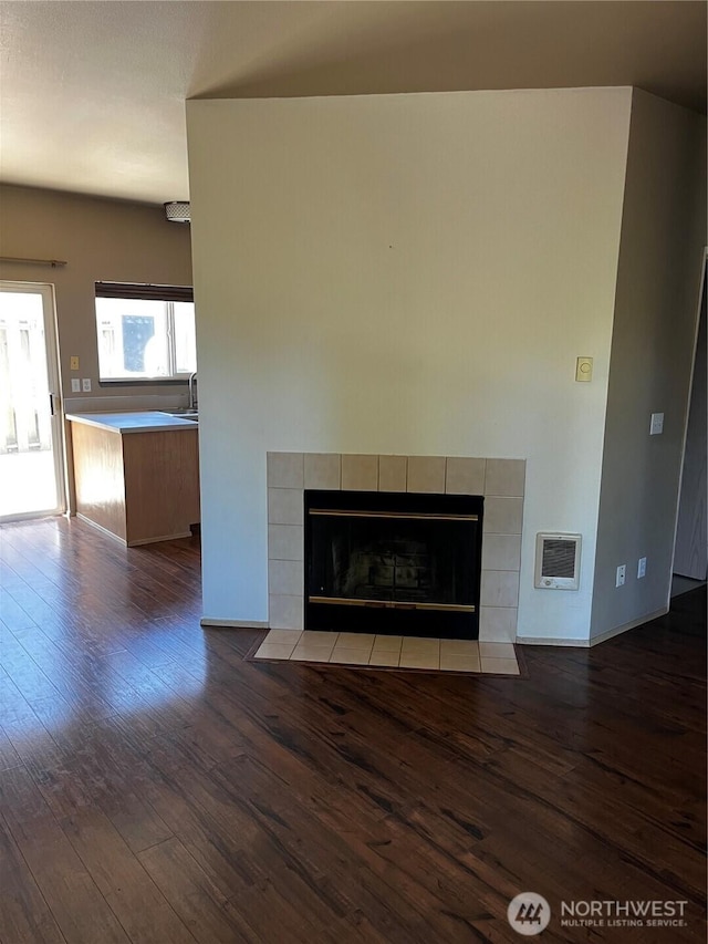 6304 Barstow Ln SE Unit 7, Lacey, WA 98513 - detailed view of wood finished floors, a tiled fireplace, and heating unit