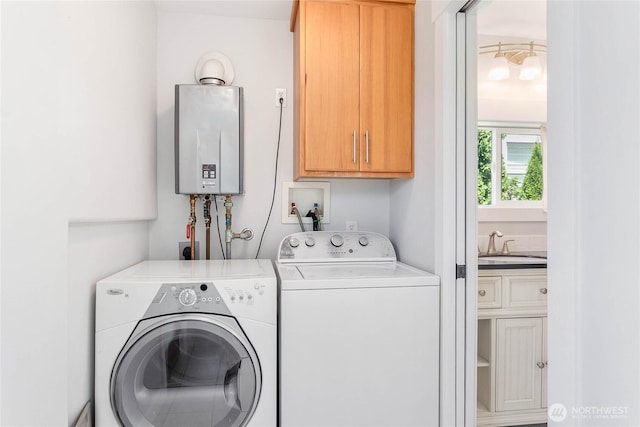 2427 Lincoln St, Bellingham, WA 98225 - laundry area featuring cabinet space, tankless water heater, and washing machine and clothes dryer