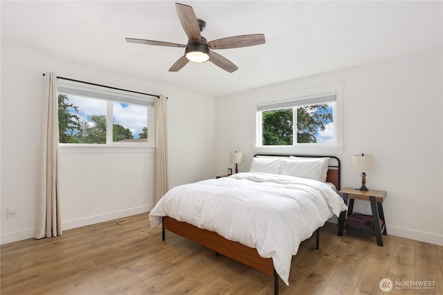 11112 234th St E, Graham, WA 98338 - bedroom featuring light wood finished floors and ceiling fan