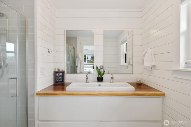 11112 234th St E, Graham, WA 98338 - full bath with vanity, a shower stall, and wood walls
