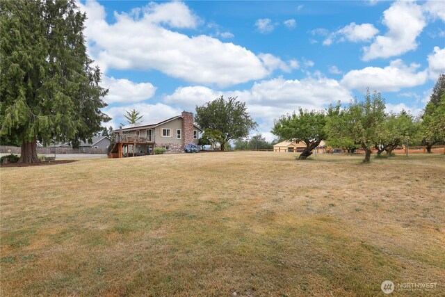11112 234th St E, Graham, WA 98338 - view of grassy yard featuring a deck and stairs