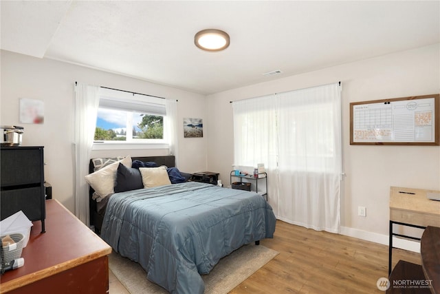 11112 234th St E, Graham, WA 98338 - bedroom featuring light wood finished floors and baseboards