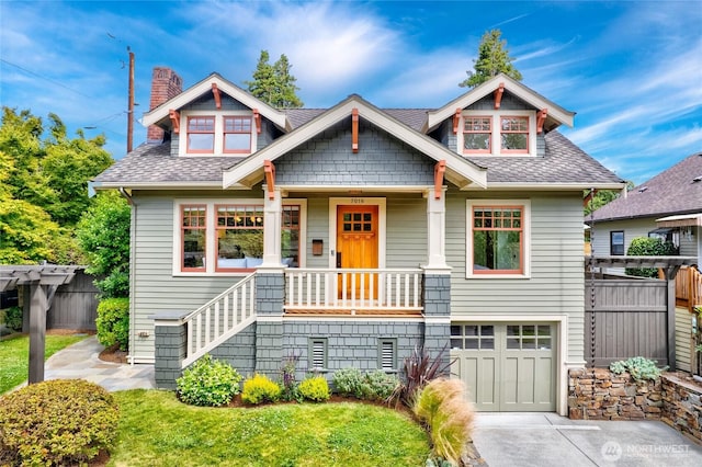7016 Fremont Ave N, Seattle, WA 98103 - craftsman house featuring a garage, a shingled roof, a chimney, driveway, and a porch