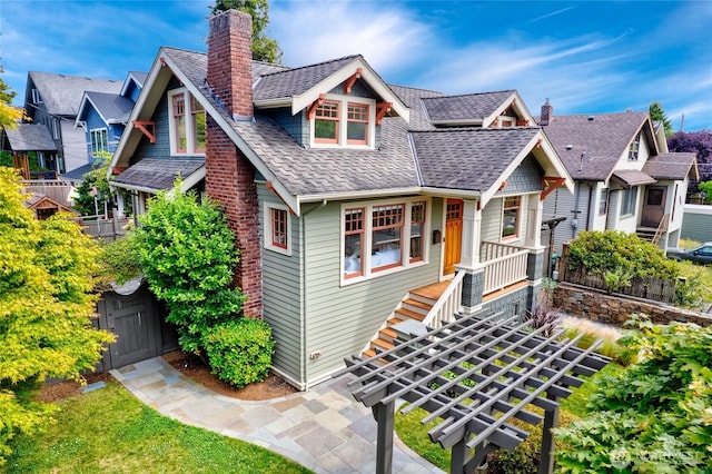 7016 Fremont Ave N, Seattle, WA 98103 - view of front of property with a chimney and a shingled roof