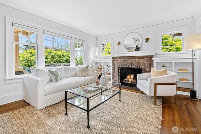 7016 Fremont Ave N, Seattle, WA 98103 - living room featuring wood finished floors, a brick fireplace, and ornamental molding
