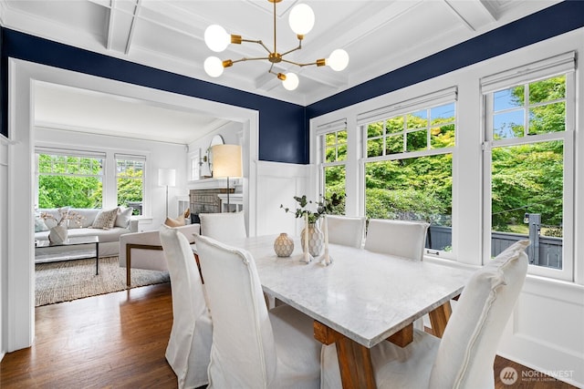7016 Fremont Ave N, Seattle, WA 98103 - dining area with a decorative wall, coffered ceiling, plenty of natural light, dark wood finished floors, and beam ceiling