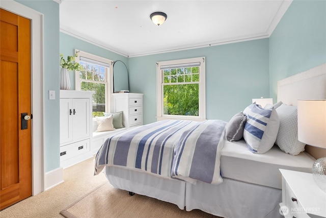7016 Fremont Ave N, Seattle, WA 98103 - bedroom featuring ornamental molding, multiple windows, and carpet