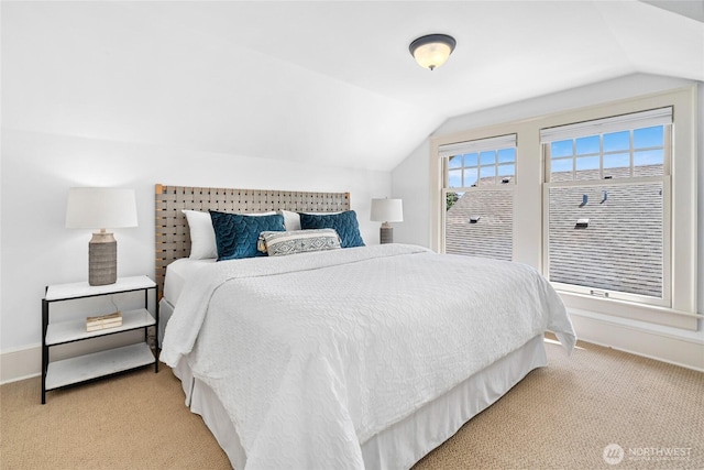 7016 Fremont Ave N, Seattle, WA 98103 - bedroom featuring vaulted ceiling and light carpet