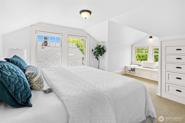 7016 Fremont Ave N, Seattle, WA 98103 - bedroom with light carpet and vaulted ceiling